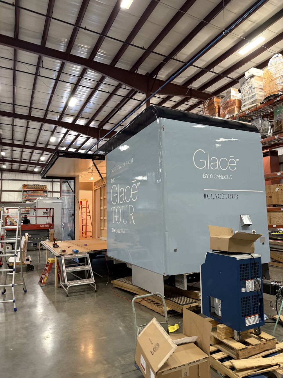 Glace trailer wrap in progress inside the shop bay